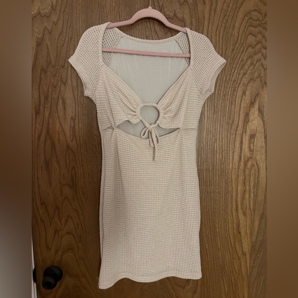 Curvy, knitted dress, slip on the inside, very comfy.